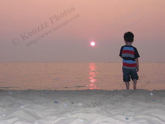 Sunset at Point Betsie (Frankfort, MI)...while getting ready to shoot the sunset this young boy stepped into the frame...hmmmm...this might be good!