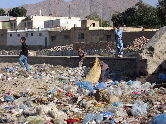 Kabul kids rummaging through street trash