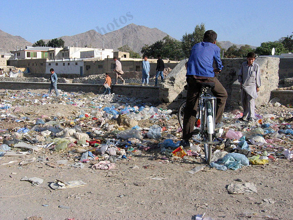 Kabul kids rummaging through street trash