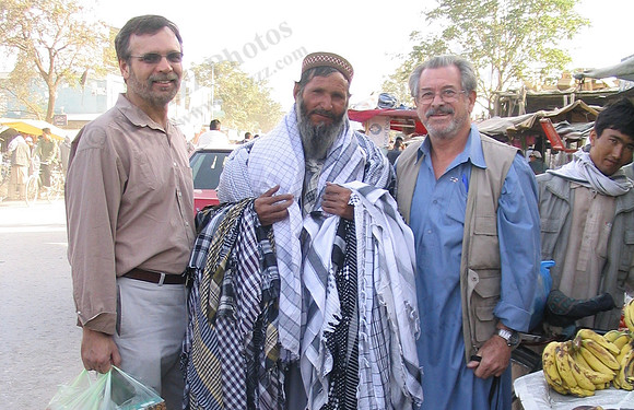 Afghan man selling scarfs at Kabul street bazaar