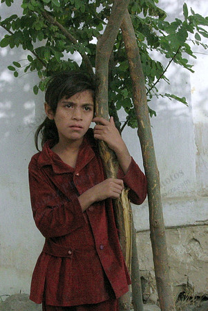 Afghan Girl.  While this may look like a pose its really a candid shot as she was looking across a school yard at some older girls. I wonder what was going through her head?